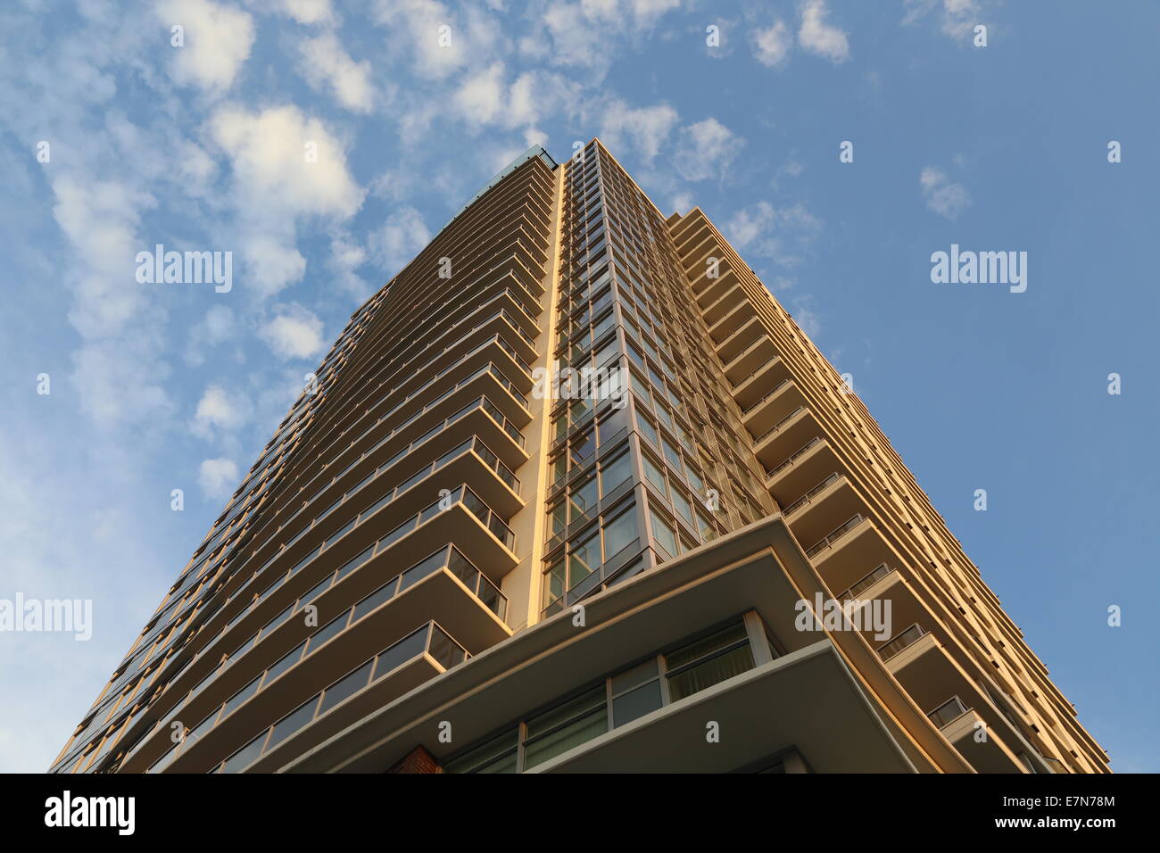 Coquitlam, BC Canada - August 24,  2014 : Brand new high rise building against blue sky in Coquitlam BC Canada. Stock Photo