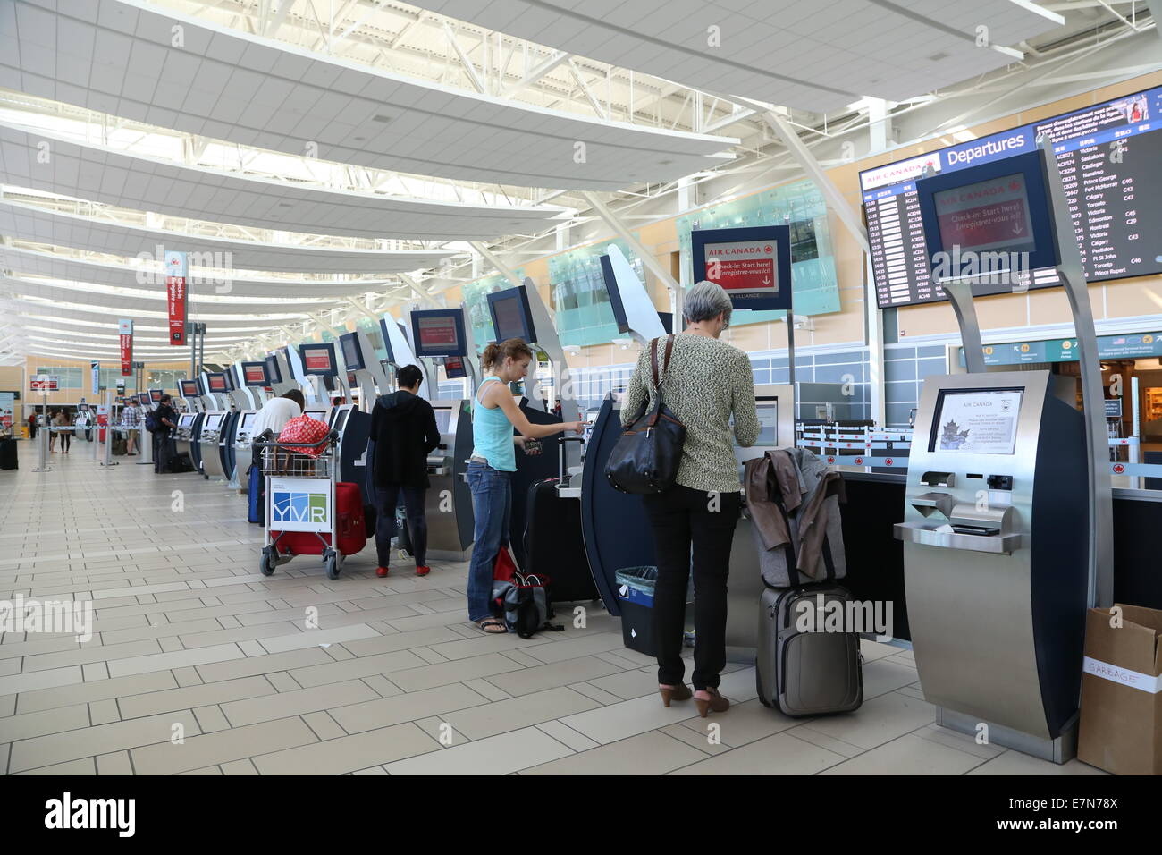 Self check in counter inside YVR airport Stock Photo