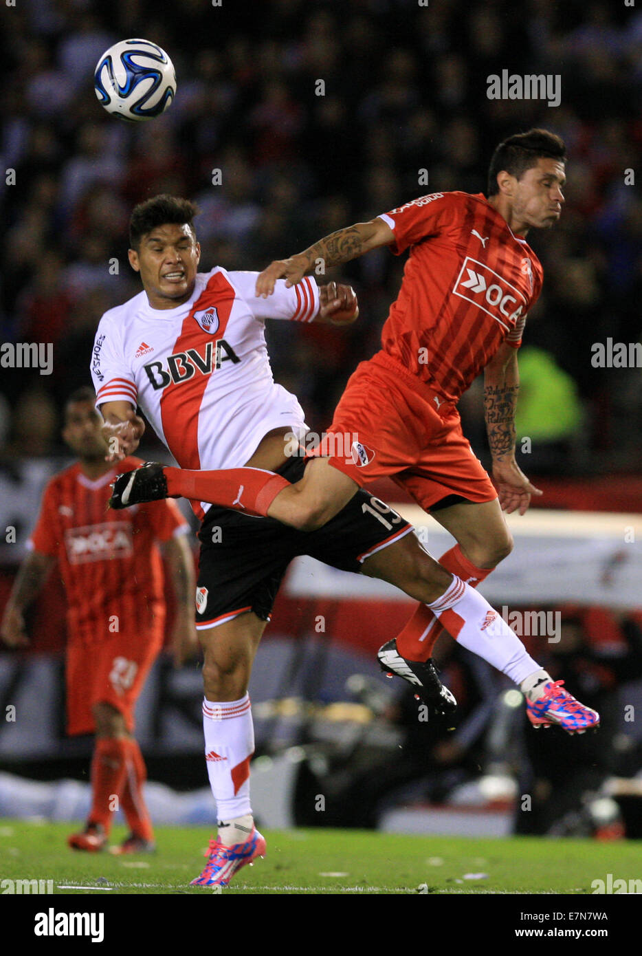 Buenos Aires, Argentina. 21st Sep, 2014. Teofilo Gutierrez (L) of River Plate vies with Victor Cuesta (R) of Independiente during the First Division Tournament match, held at Antonio Vespucio Liberti Stadium, in Buenos Aires, Argentina, on Sept. 21, 2014. Credit:  Martin Zabala/Xinhua/Alamy Live News Stock Photo