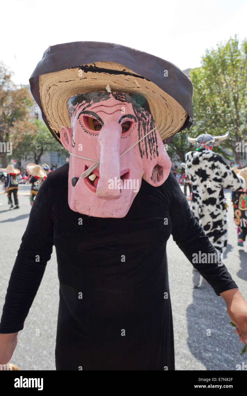 Mexican mask costume in Latin festival parade - Washington, DC USA Stock Photo