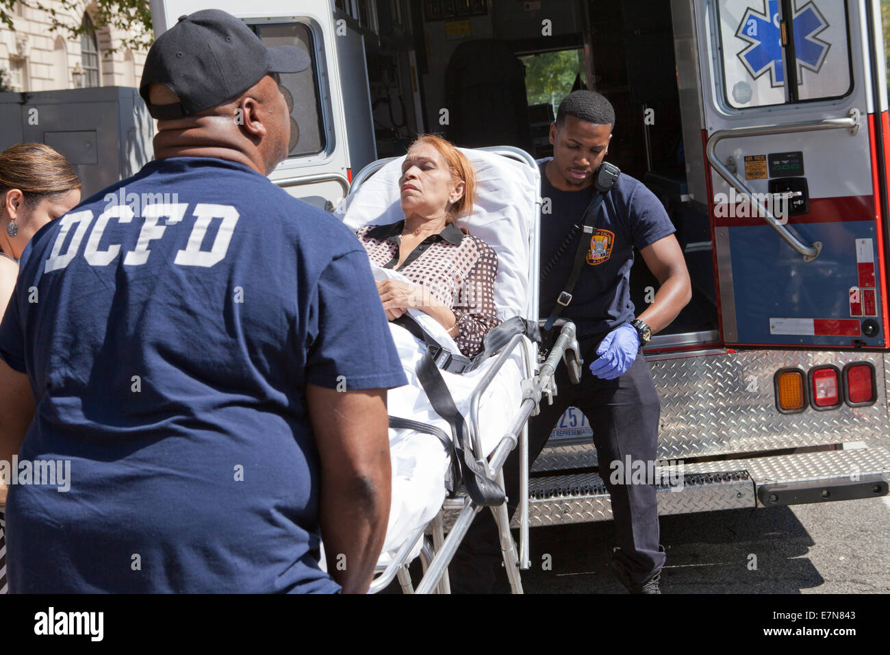 DCFD EMT loading patient into ambulance - Washington, DC USA Stock Photo