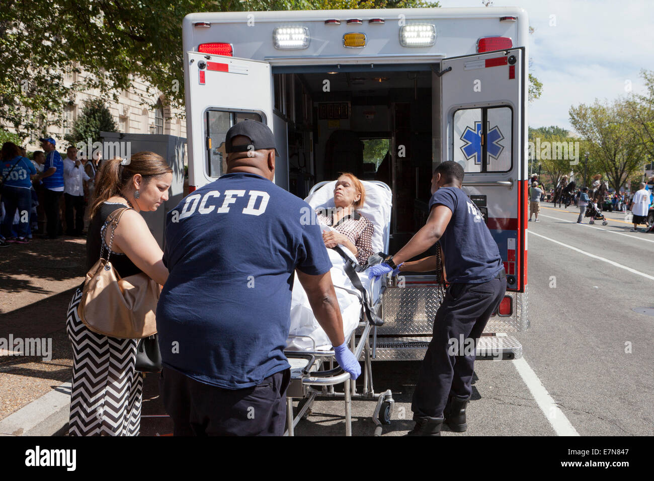 DCFD EMT loading patient into ambulance - Washington, DC USA Stock Photo