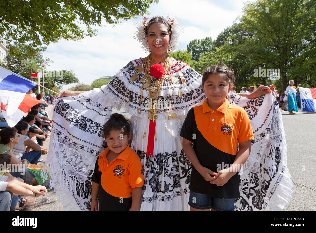 Jarabe Tapatio dancer posing with children at outdoor festival - Washington, DC USA Stock Photo