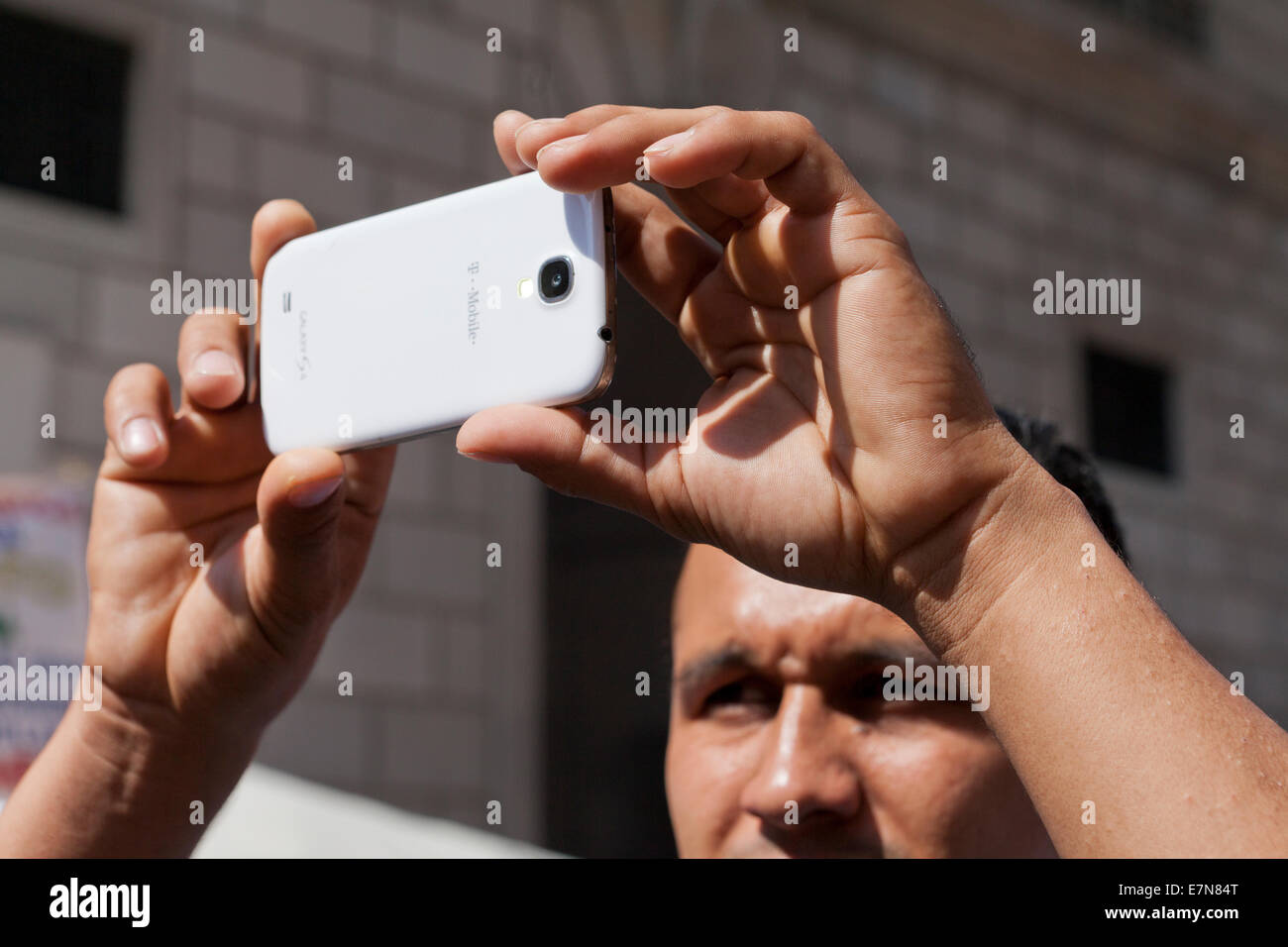 Man video taping with mobile phone - USA Stock Photo