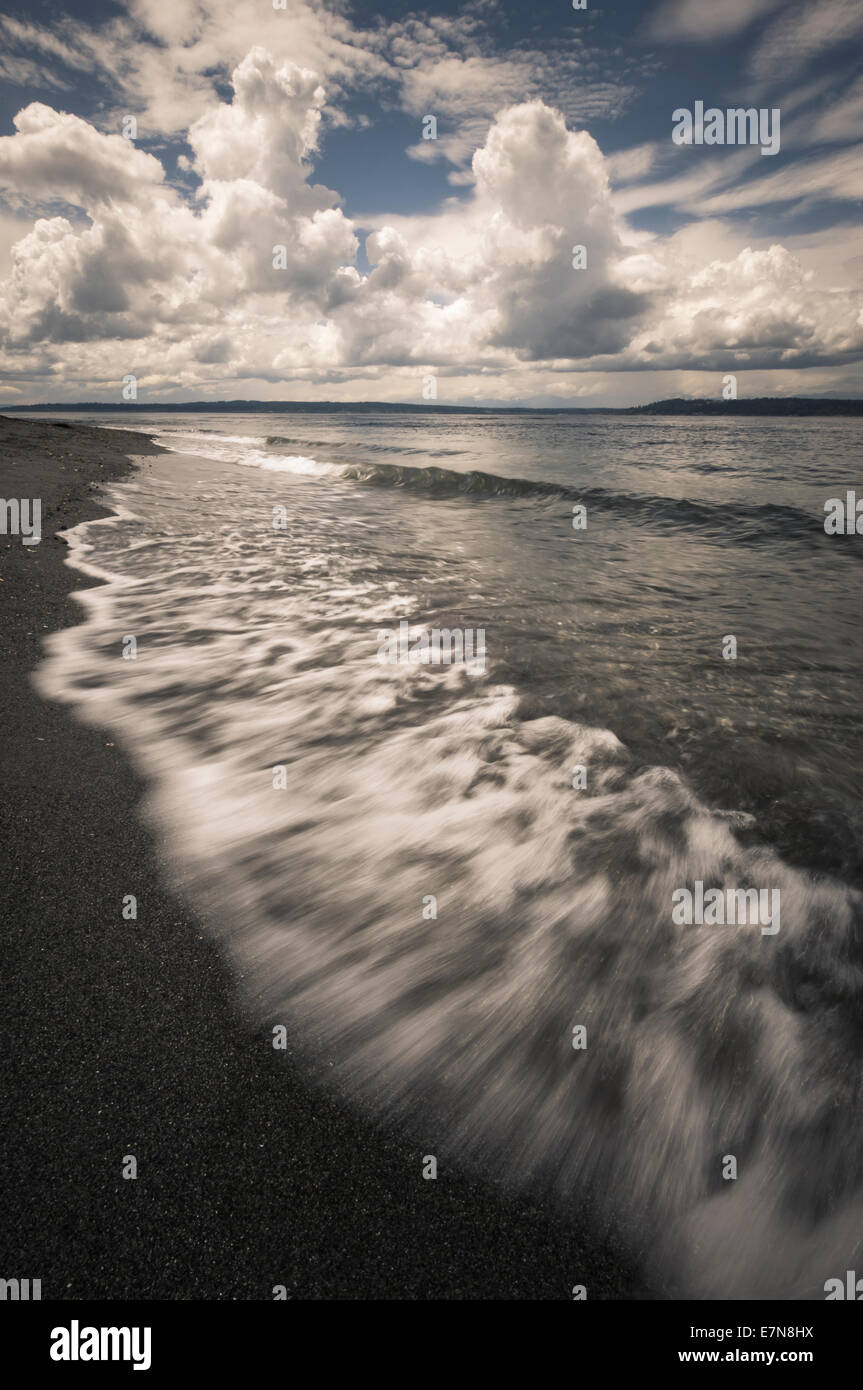 Waves wash up on the beach at Marina Beach Park, Edmonds, Washington, USA Stock Photo