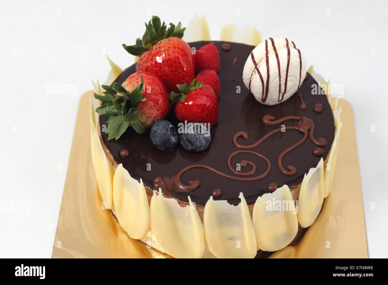 Dark chocolate strawberry cake on white background Stock Photo - Alamy