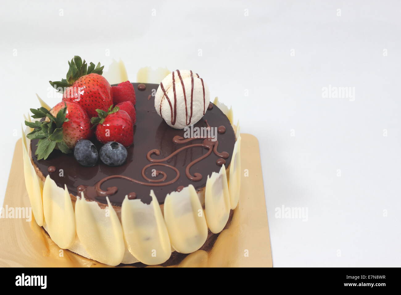 Dark chocolate strawberry cake on white background Stock Photo - Alamy