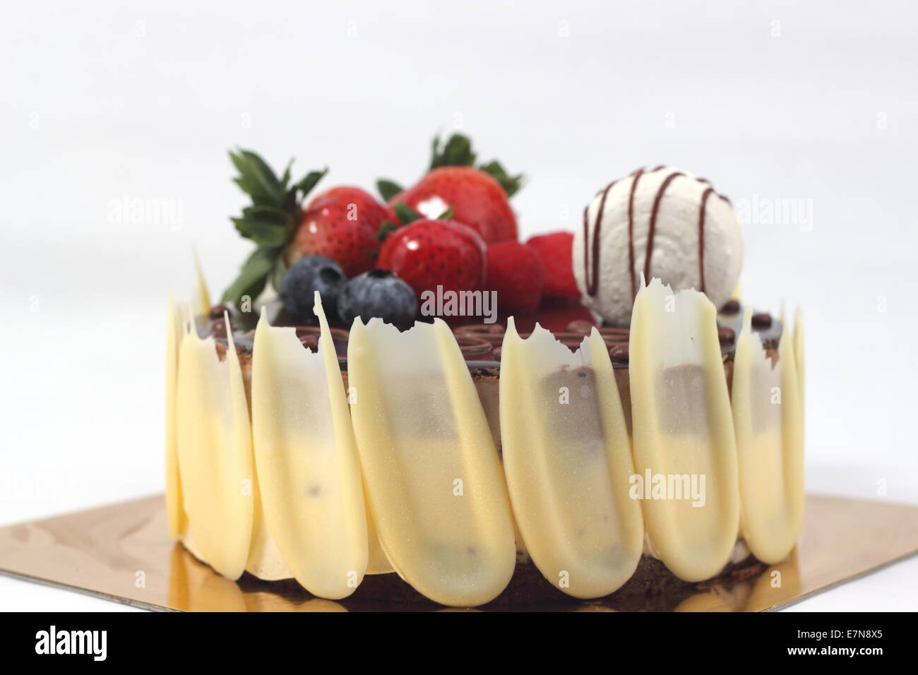 Dark chocolate strawberry cake on white background Stock Photo - Alamy