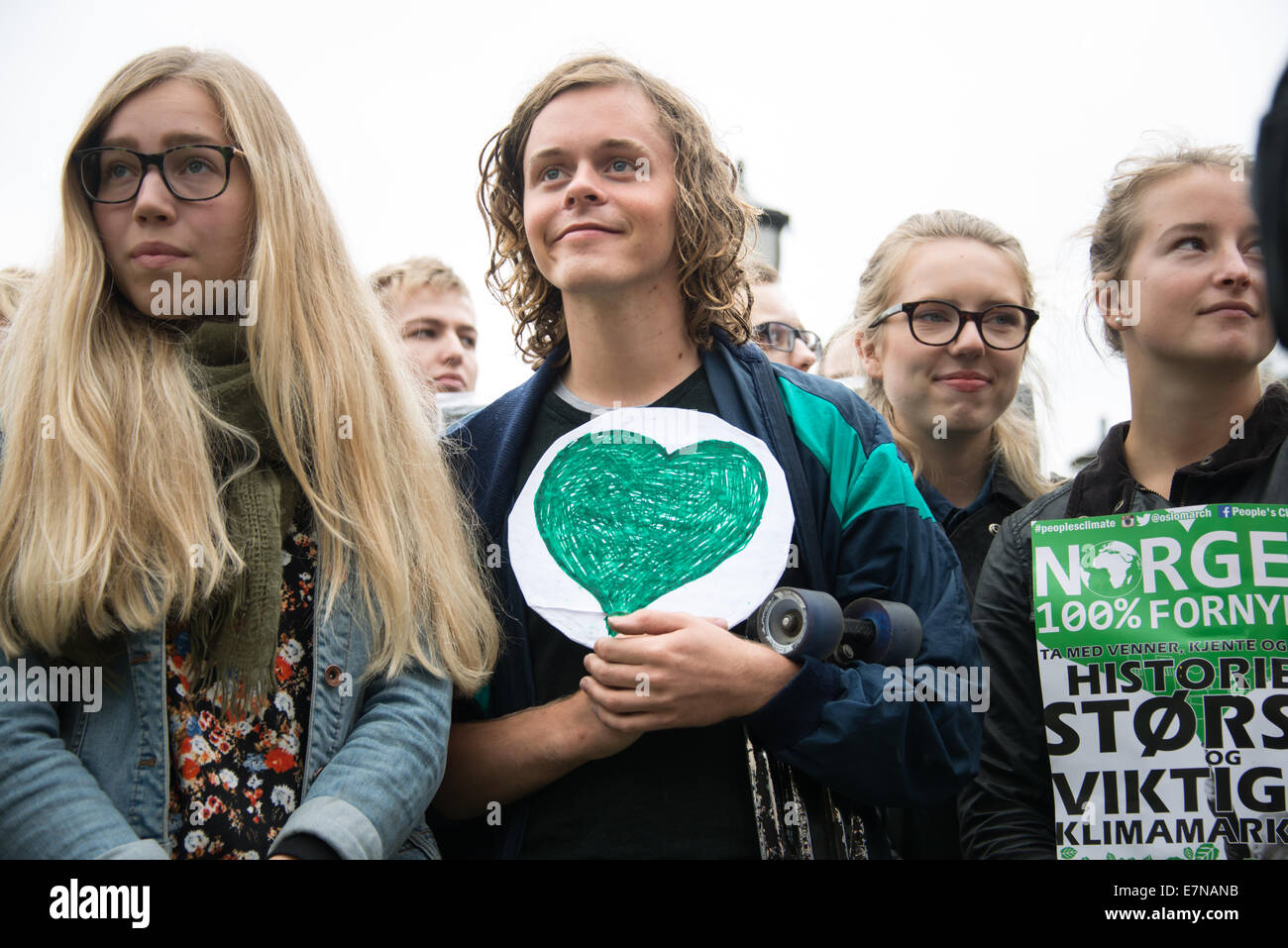 Oslo, Norway. 21st Sep, 2014. A young man carries a green heart as thousands march through downtown Oslo, Norway, to support action on global climate change, September 21, 2014. According to organizers of 'The People's Climate March', the Oslo demonstration was one of 2,808 solidarity events in 166 countries, which they claim was 'the largest climate march in history'. Credit:  Ryan Rodrick Beiler/Alamy Live News Stock Photo