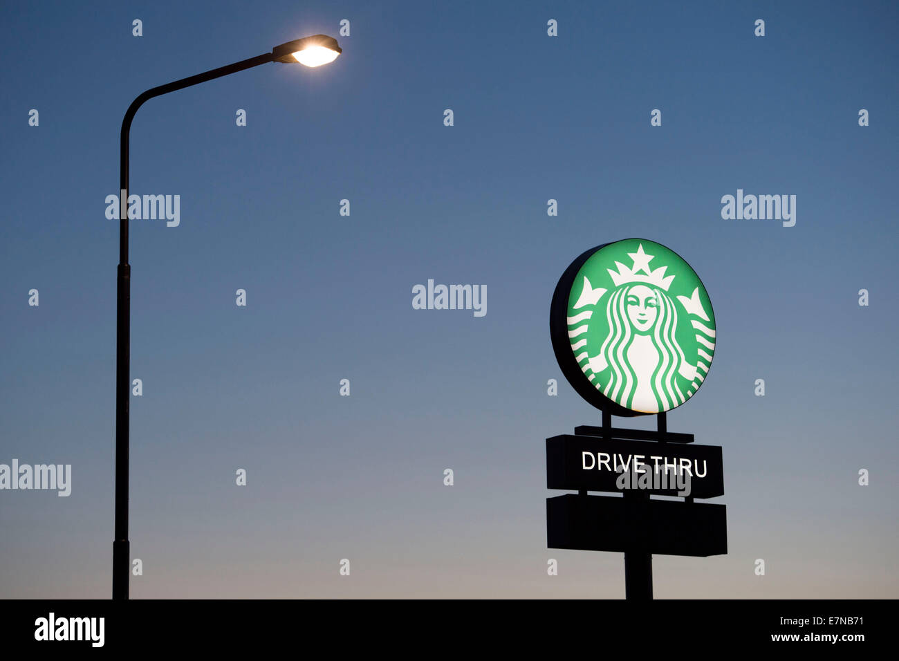 A Starbucks coffee drive through sign logo. Stock Photo