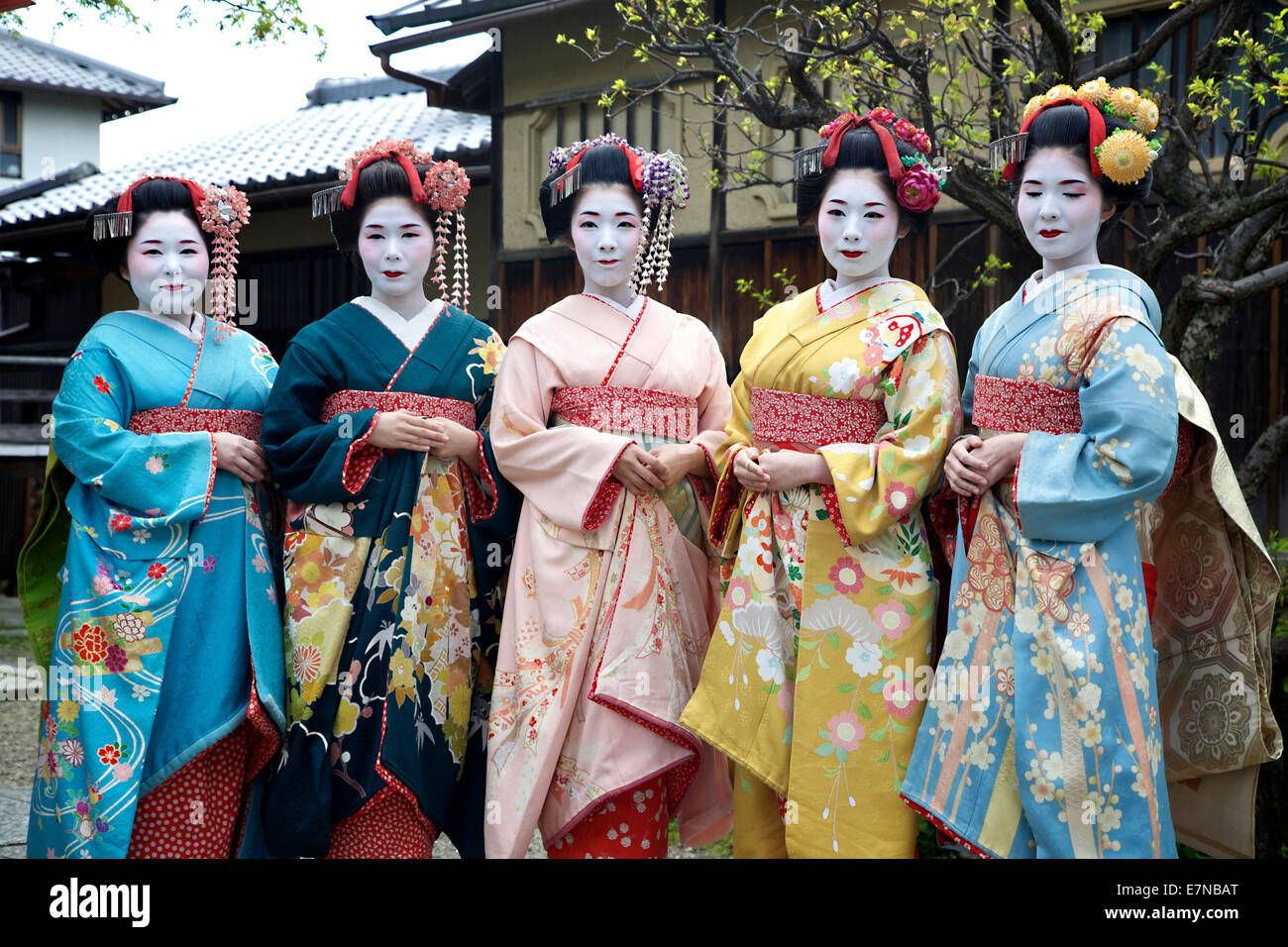Group of Japanese women, geishas posing for a picture, Gion area, Kyoto, Japan, Asia. Traditional geisha make-up and dress Stock Photo