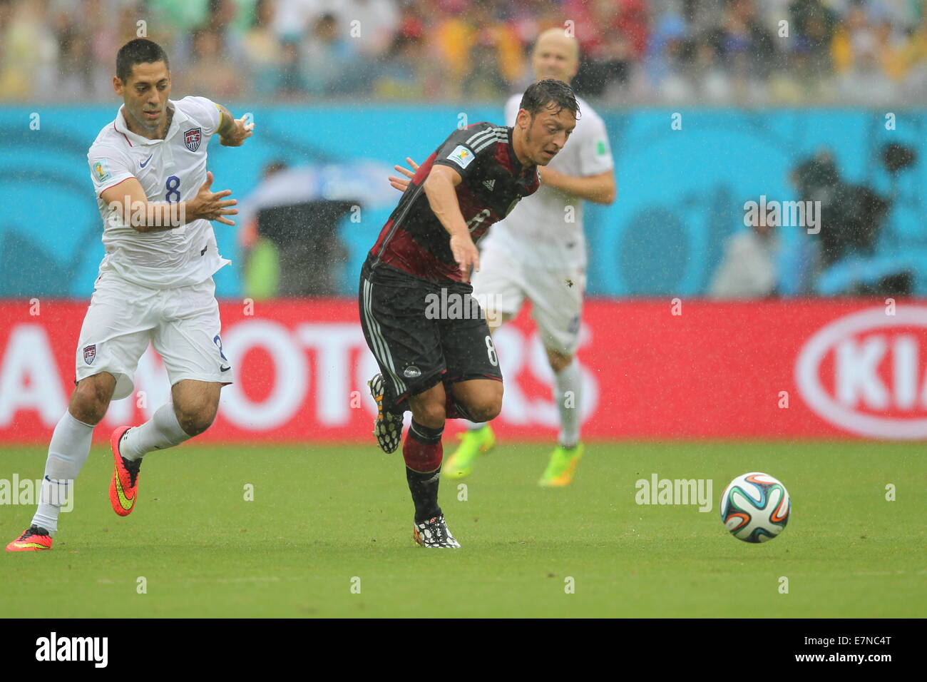 Clint Dempsey of USA and Mesut Oezil of Germany. USA v Germany. Group match. FIFA World Cup Brazil 2014. Arena Pernambuco Recife Stock Photo