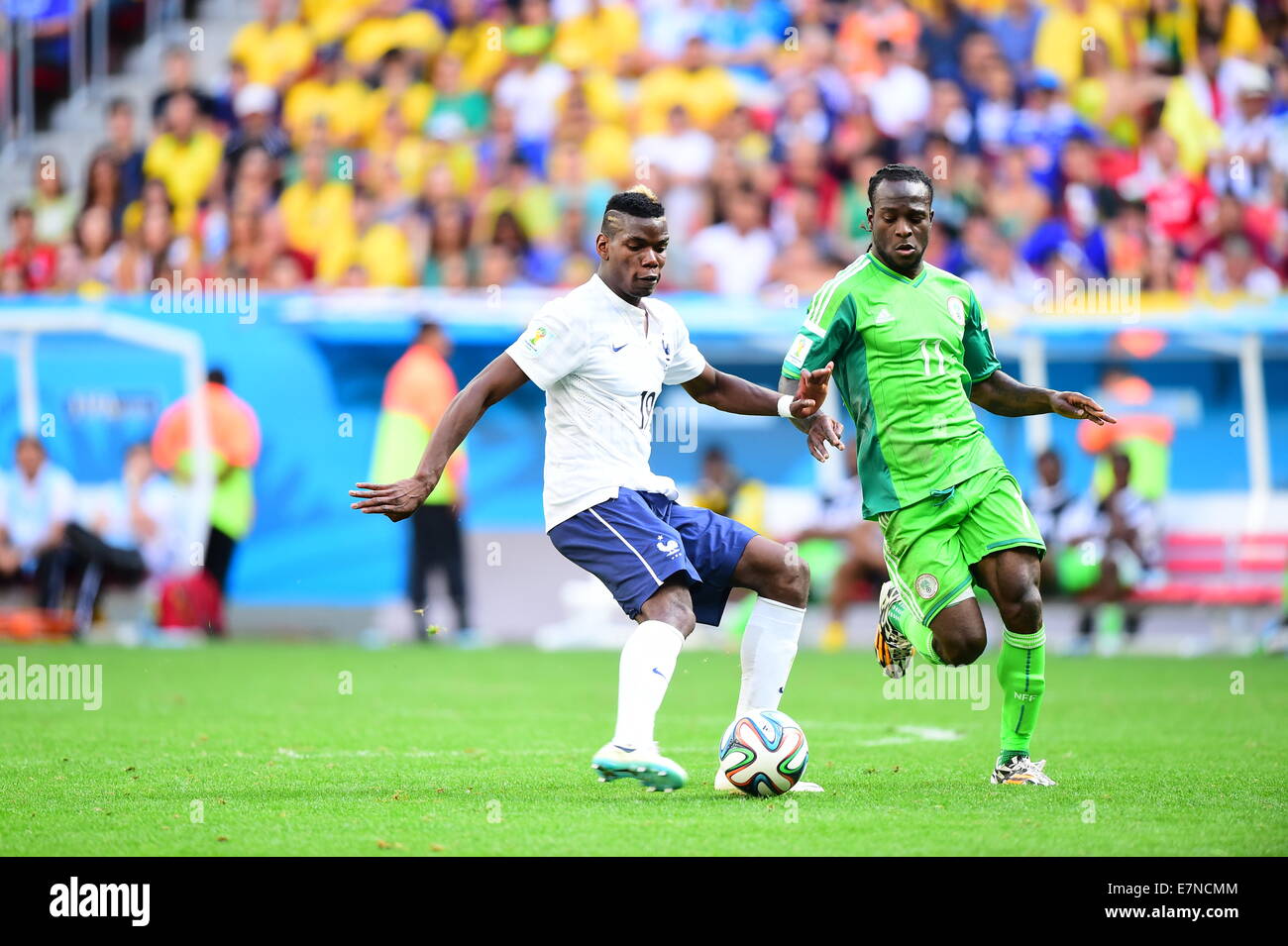Paul Pogba of France and Victor Moses of Nigeria. France v Nigeria, round of 16. FIFA World Cup Brazil 2014. National stadium Br Stock Photo