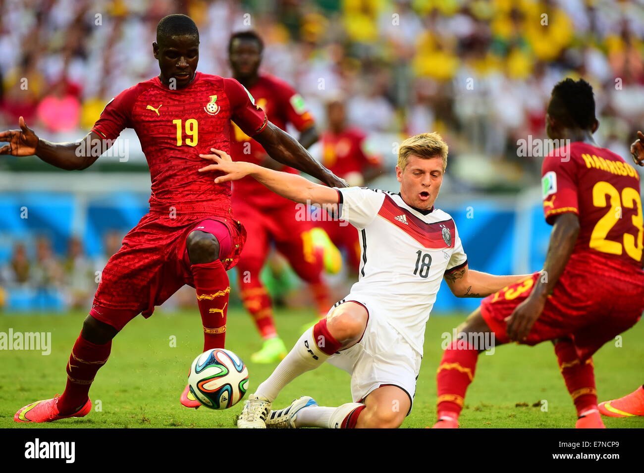 Toni Kroos of Germany and Jonathan Mensah of Ghana. Germany v Ghana, group match. FIFA World Cup 2014 Brazil. Castelao Stadium, Stock Photo