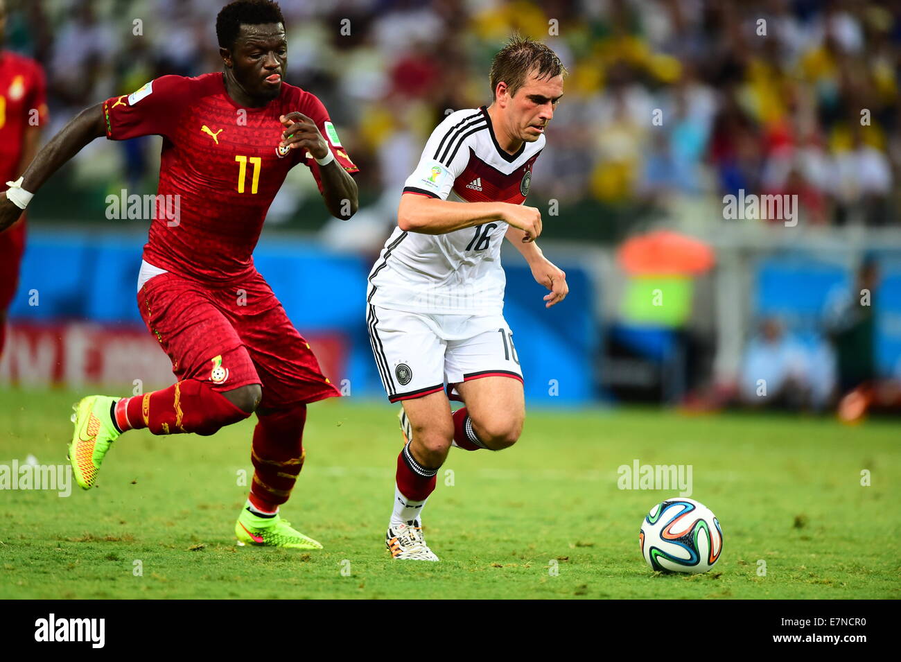 Philipp Lahm of Germany and Sulley Muntari of Ghana. Germany v Ghana, group match. FIFA World Cup 2014 Brazil. Castelao Stadium, Stock Photo