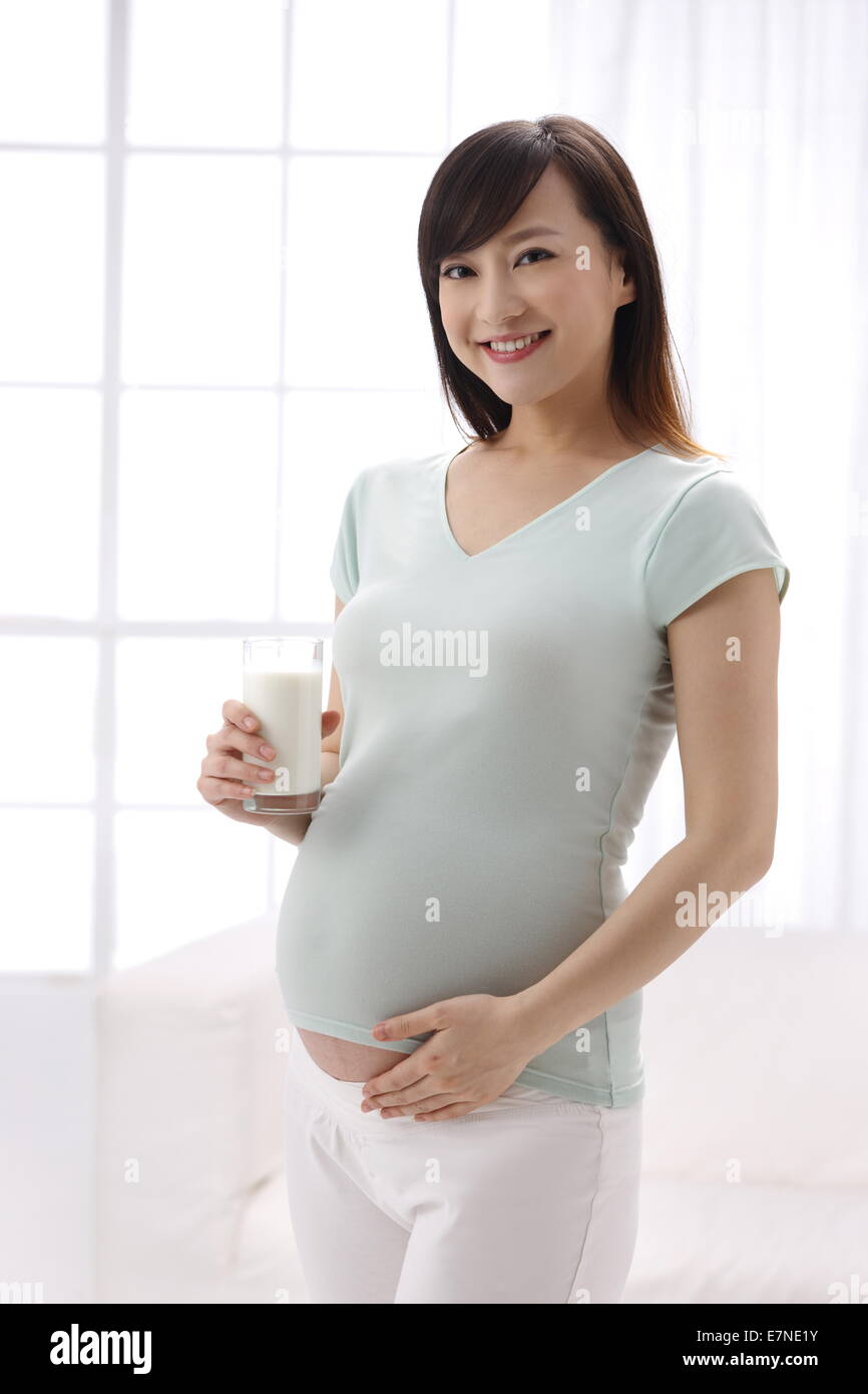 Pregnant Woman Drinking Milk Stock Photo Alamy