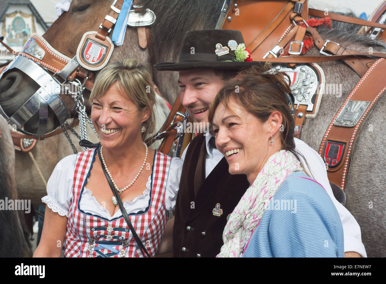 Munich, Germany. 21st September, 2014.  Oktoberfest Crowds of visitors in Front of the Spatenbrau Tent celebrating the festivities with Smiling Faces. The Festival runs from Sept. 20 – Oct. 5 in Munich, Germany. Credit:  Steven Jones/Alamy Live News Stock Photo