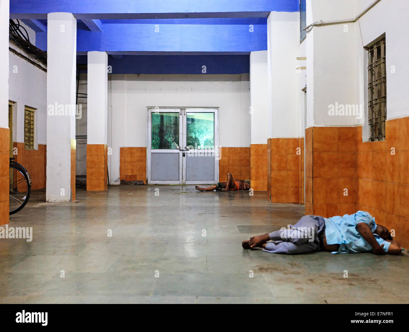 Homeless people in need sleeping on the floor Stock Photo
