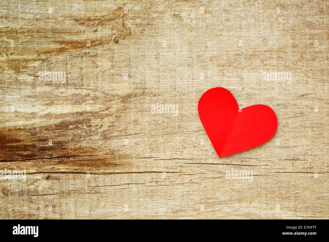 Red paper heart on grunge wooden background with copy space for your ...