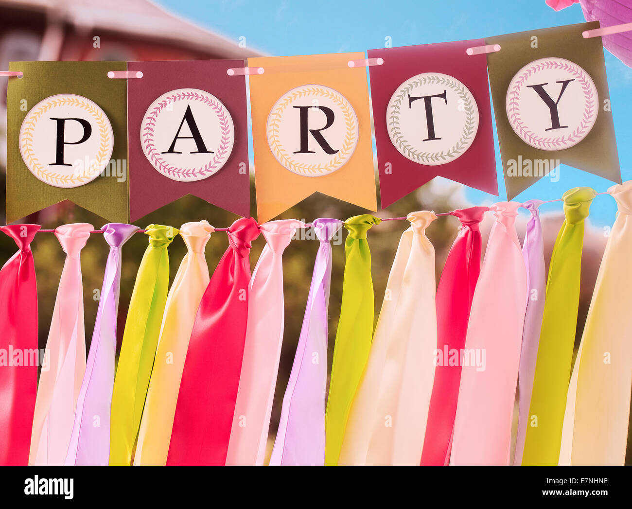Colourful festive swag banner with ribbons for party decoration Stock Photo