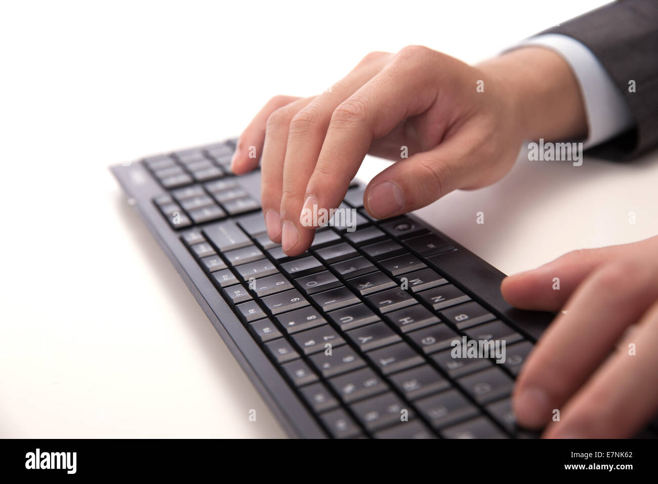 Fingers typing computer keyboard Stock Photo Alamy