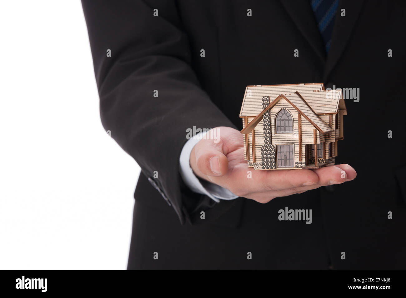 Hand holding house model Stock Photo - Alamy