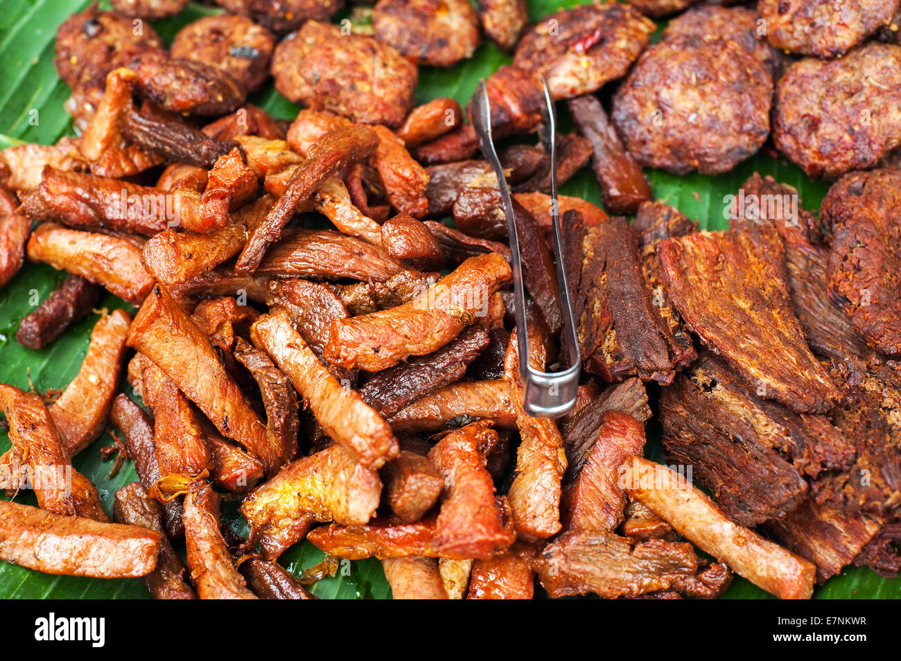 traditional-asian-food-at-market-delicious-spicy-grilled-pork-meat