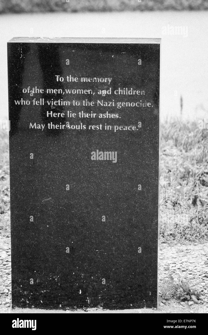 Memorial stone at the Auschwitz-Birkenau concentration camp to the men, women and children who fell victim to the Nazi genocide, Auschwitz, Poland Stock Photo