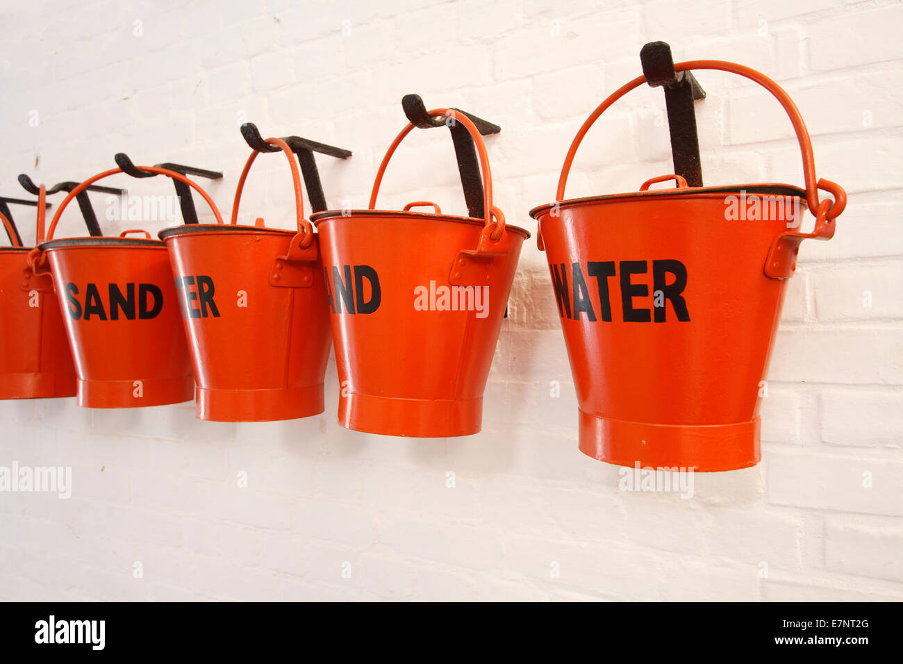 Red fire buckets water and sand Fort Nelson Stock Photo Alamy