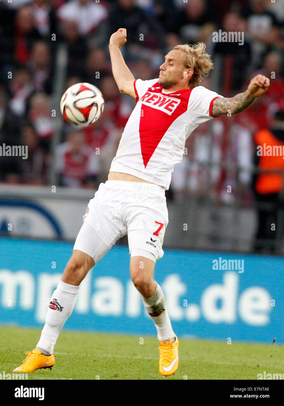 Cologne, Germany. 21st Sep, 2014. Cologne's Marcel Risse controls the ball during the Bundesliga soccer match between 1st FC Koeln and Borussia Moenchengladbach in Cologne, Germany, 21 September 2014. Credit:  dpa picture alliance/Alamy Live News Stock Photo