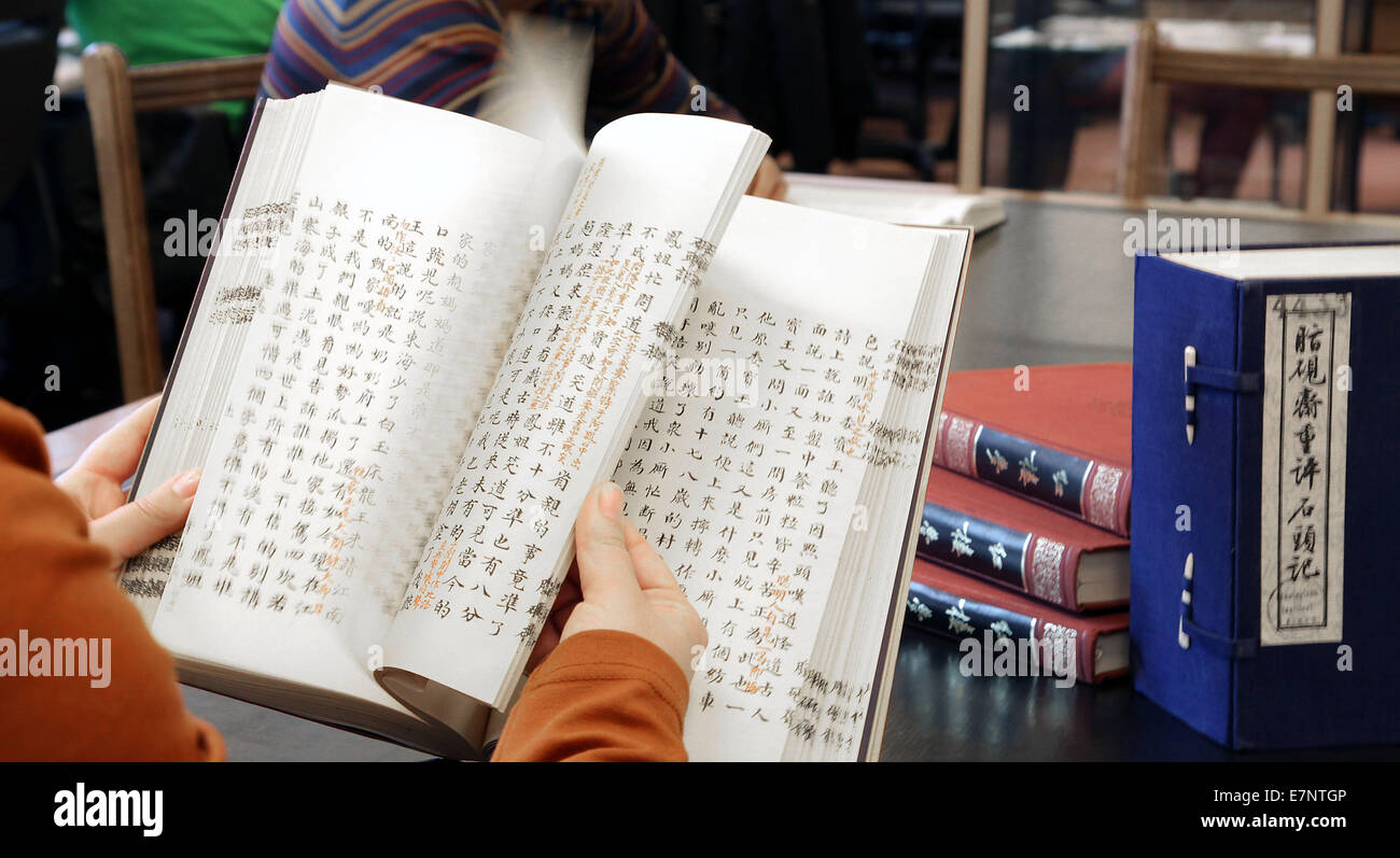 Student reading studying chinese literature in a Library.University ...