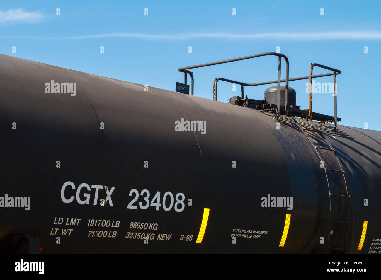 Close up shot of a general purpose insulated black tanker rail car (DOT 111A100W1 type) on a