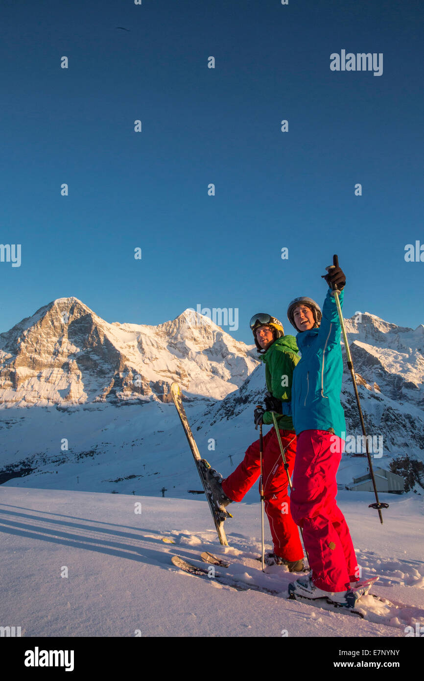 Ski, couple, enjoys, evening sun, Männlichen, mountain, mountains, ski, skiing, Carving, winter, winter sports, canton Bern, Ber Stock Photo