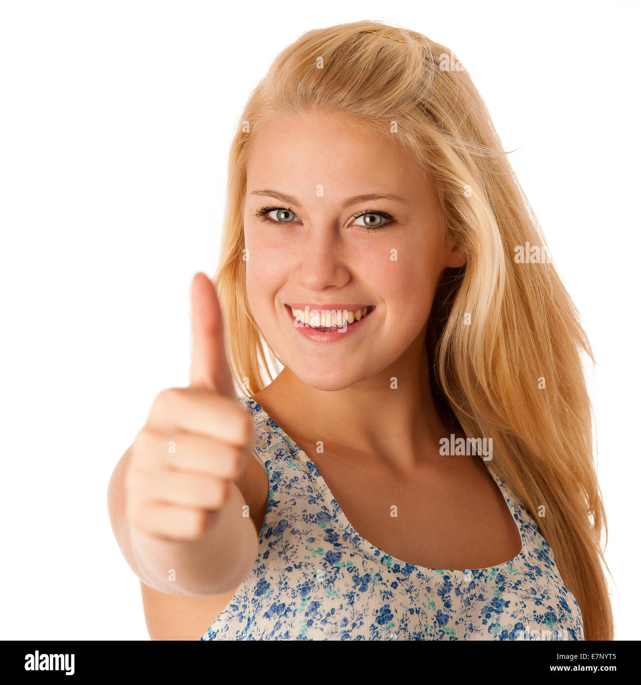 Young business woman with blonde hair and blue eyes gesturing success showing thumb up isolated over white Stock Photo