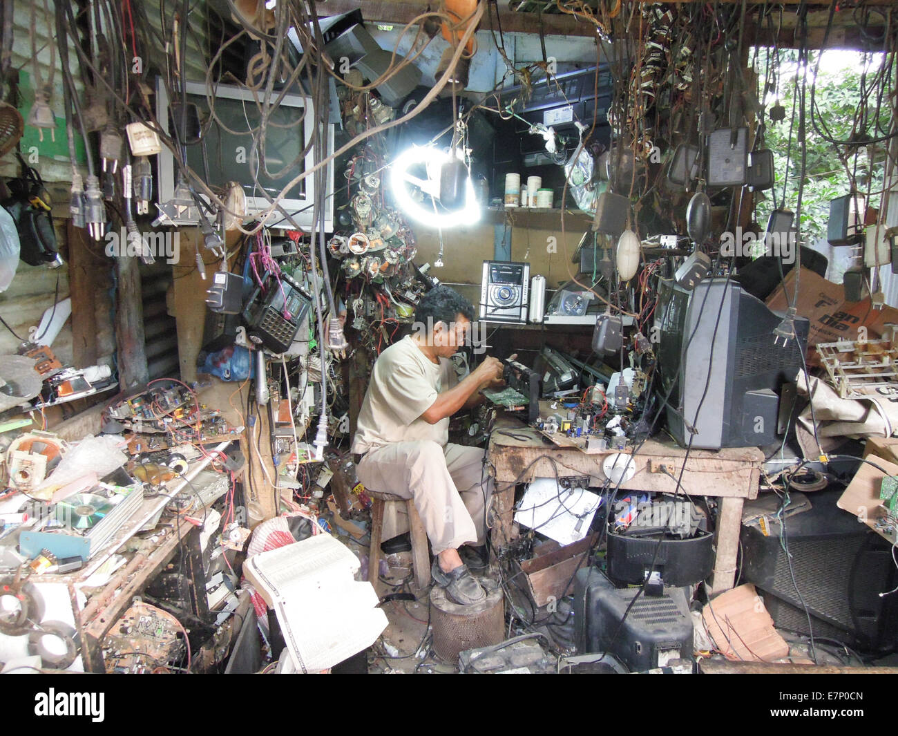 Guatemala, Sayaxche, TV, adjust, disorder, electric, wires, electronics, multitude, person, radio, repair, repairman, shop, ster Stock Photo