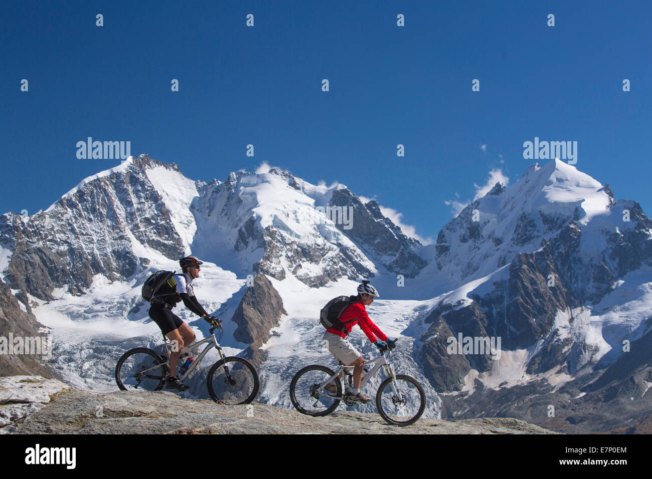 Engadin, Engadine, biker, Fuorcla Surlej, Piz Bernina, mountain, mountains, mountain bike, bike, couple, couples, bicycle, bicyc Stock Photo