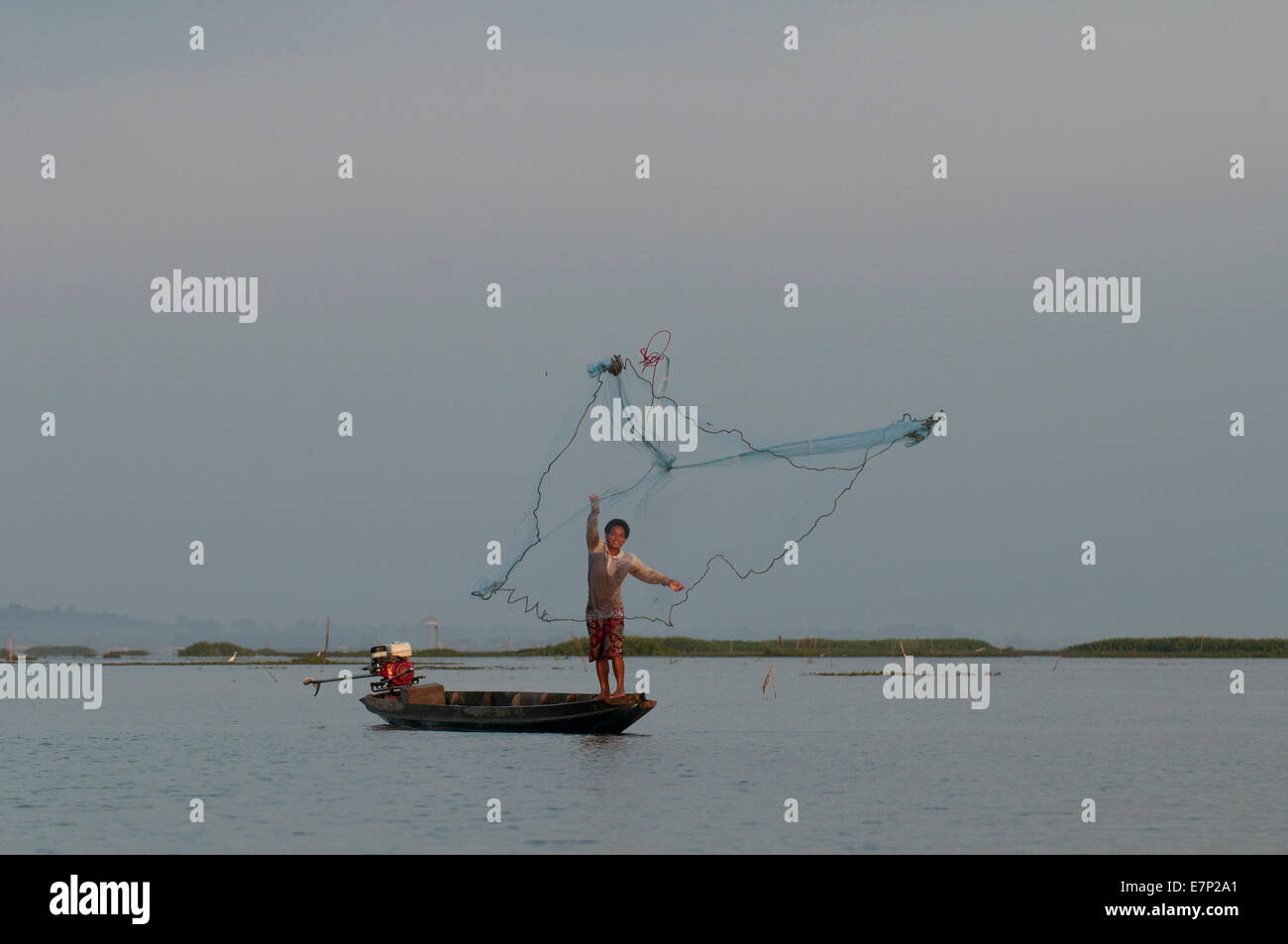 Fisherman with net hi-res stock photography and images - Alamy