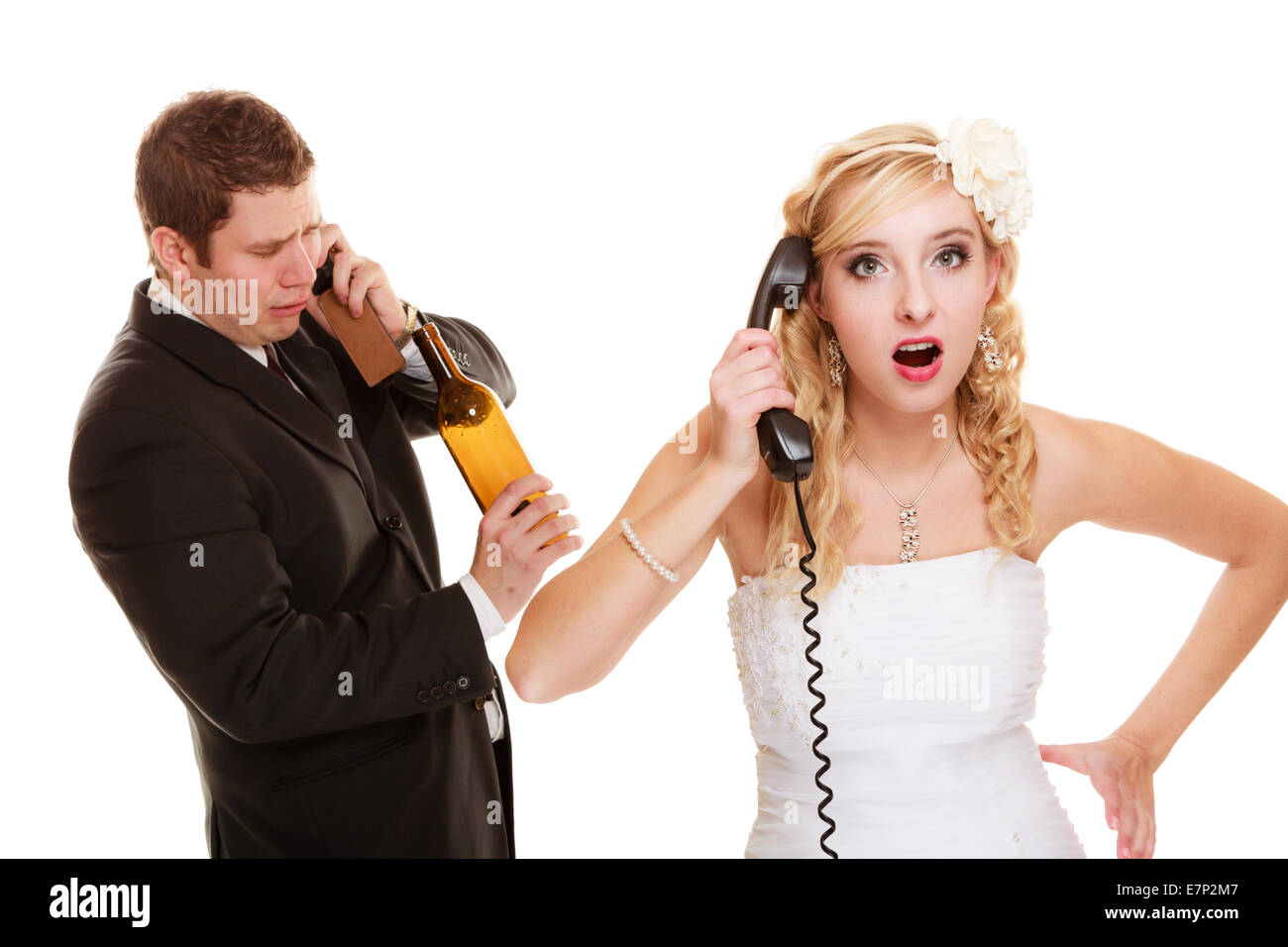 Wedding relationship difficulties. Angry woman and drunk man talking on the phone. Couple bride and groom quarrelling isolated o Stock Photo