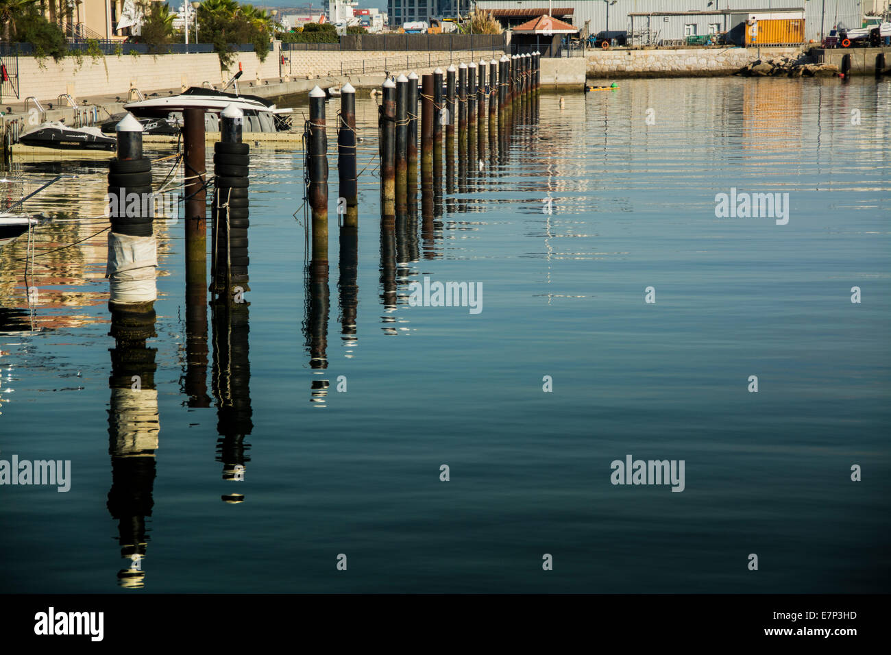 Berthing poles at Queensway Quay Marina in Gibraltar for the town house and apartments. Marina berths and moorings. Stock Photo