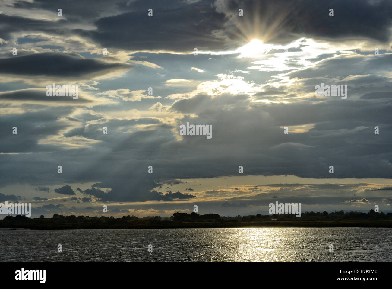 Europe, France, Languedoc- Roussillon, Camargue, sunset, sun, silhouettes, stormy, wetland Stock Photo