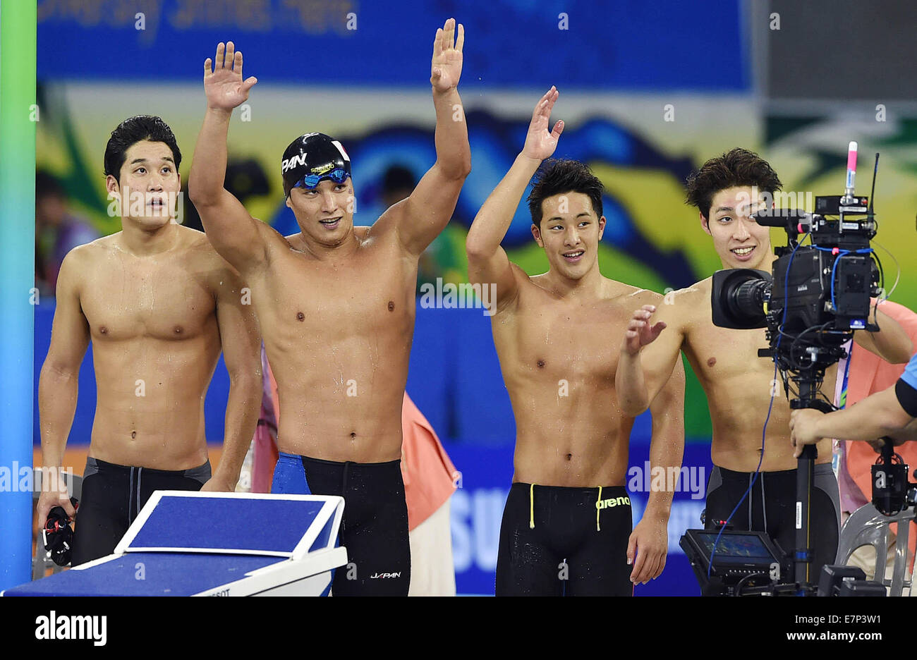 Incheon, South Korea. 22nd Sep, 2014. Japanese swimmers greet audiences after the men's 4×200m freestyle relay final of swimming event at the 17th Asian Games in Incheon, South Korea, Sept. 22, 2014. Japan won the gold medal with 7 minutes and 06.74 seconds. Credit:  Wang Peng/Xinhua/Alamy Live News Stock Photo