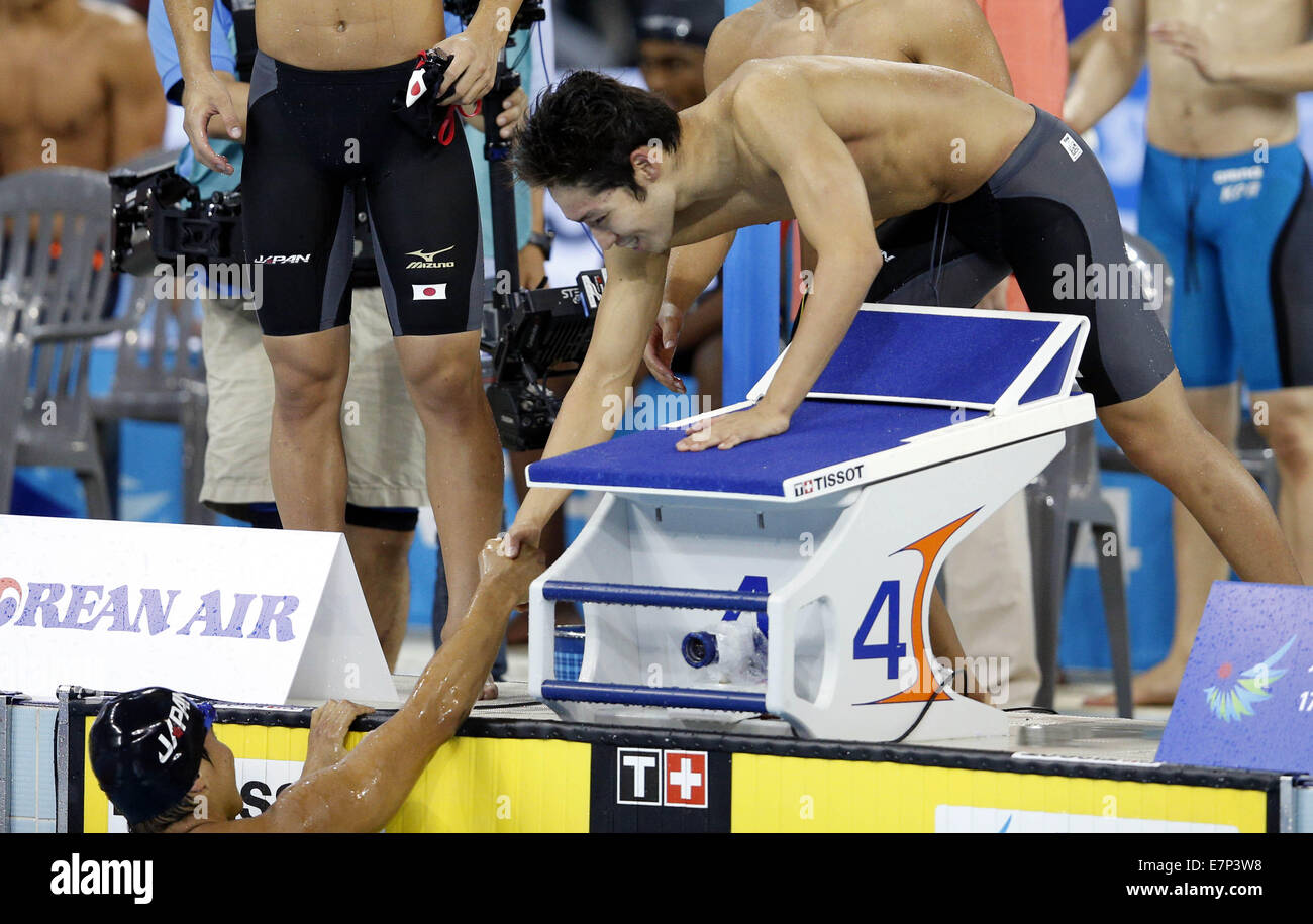 Incheon, South Korea. 22nd Sep, 2014. Japanese swimmers celebrate after the men's 4×200m freestyle relay final of swimming event at the 17th Asian Games in Incheon, South Korea, Sept. 22, 2014. Japan won the gold medal with 7 minutes and 06.74 seconds. Credit:  Meng Yongmin/Xinhua/Alamy Live News Stock Photo