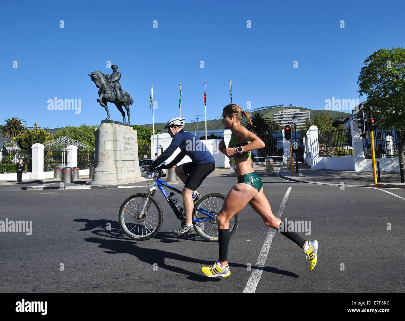 Cape Town, South Africa. 21st Sep, 2014. Irvette van Zyl of South Africa runs past the Houses of Parliament and the statue of Lovis Botha, first Prime Minister of the Union of South Africa, during the 2014 Sanlam Cape Town Marathon on September 21, 2014 in .  Credit:  Roger Sedres/Gallo Images/Alamy Live News Stock Photo
