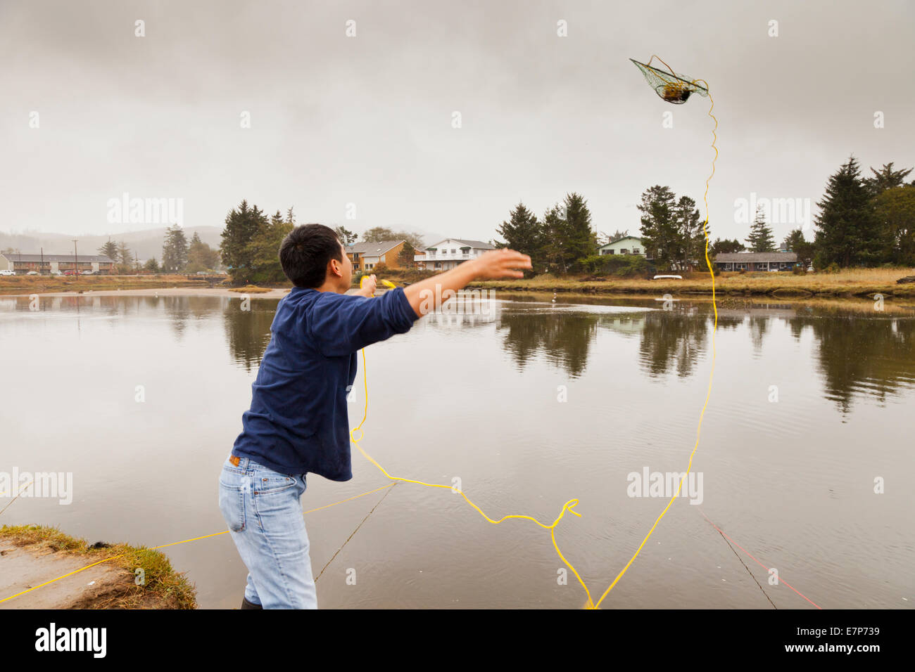 Crab fishing in the Neawanna Creek, Seaside, Oregon Stock Photo