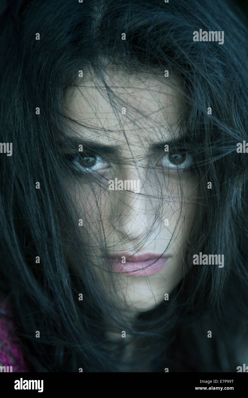 Young woman hair covering face Stock Photo