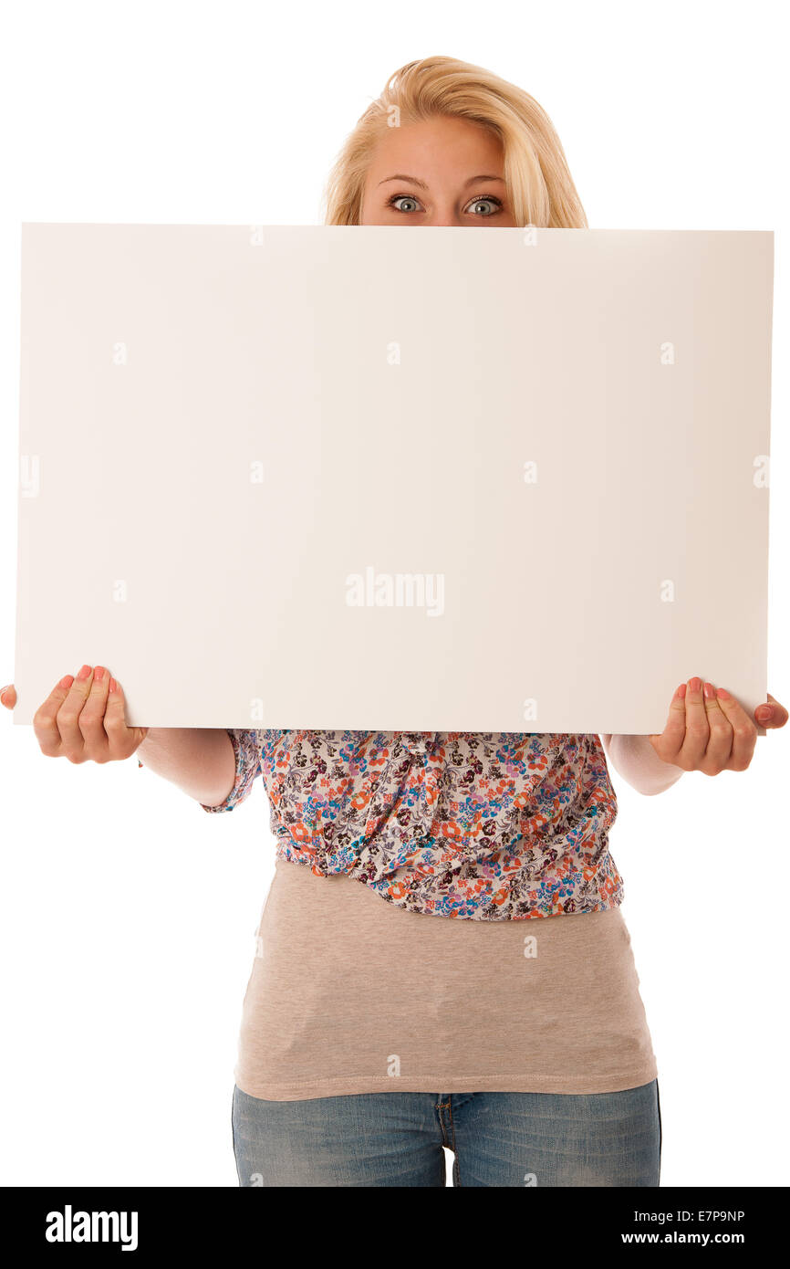 nde woman holding a blank white board in her hands for promotional text or banner isolated over white background Stock Photo