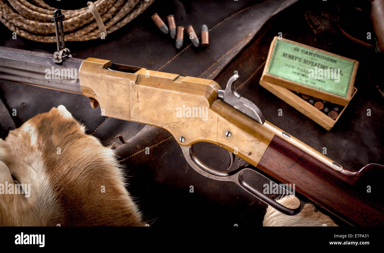 Beauty shot of Henry repeating rifle with box of original ammo in