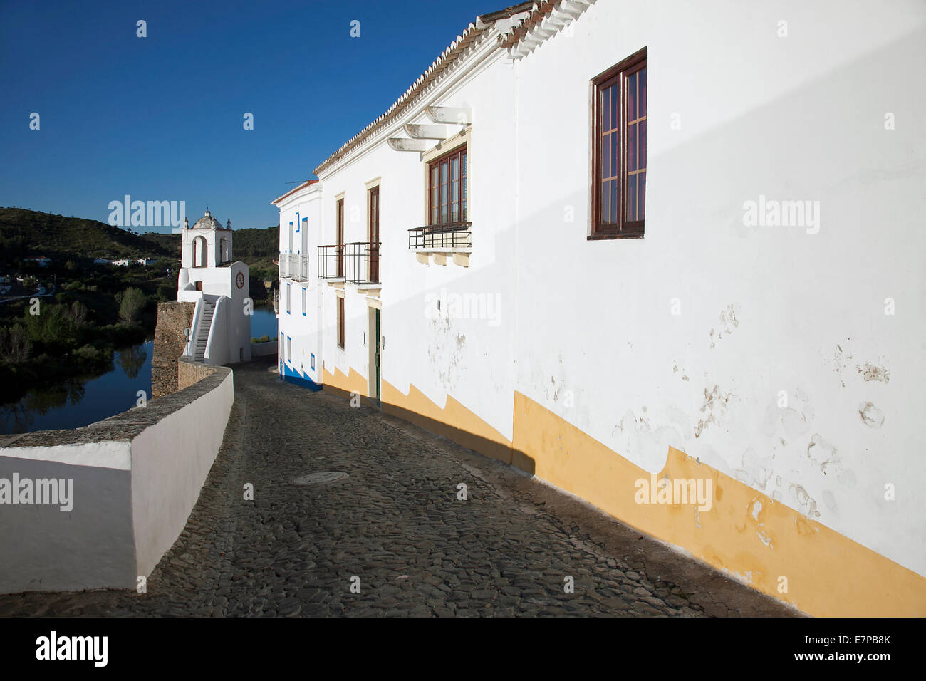 Alley along city wall in the town Mertola, Beja District, Alentejo, Portugal Stock Photo