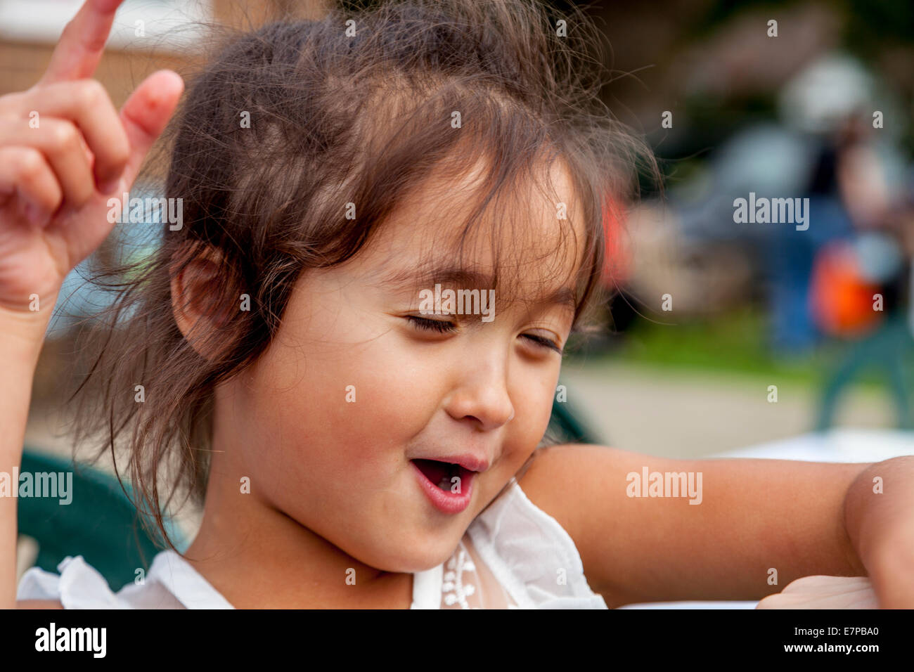 Happy Little Girl Playing, Hartfield Village Fete, Sussex, England Stock Photo