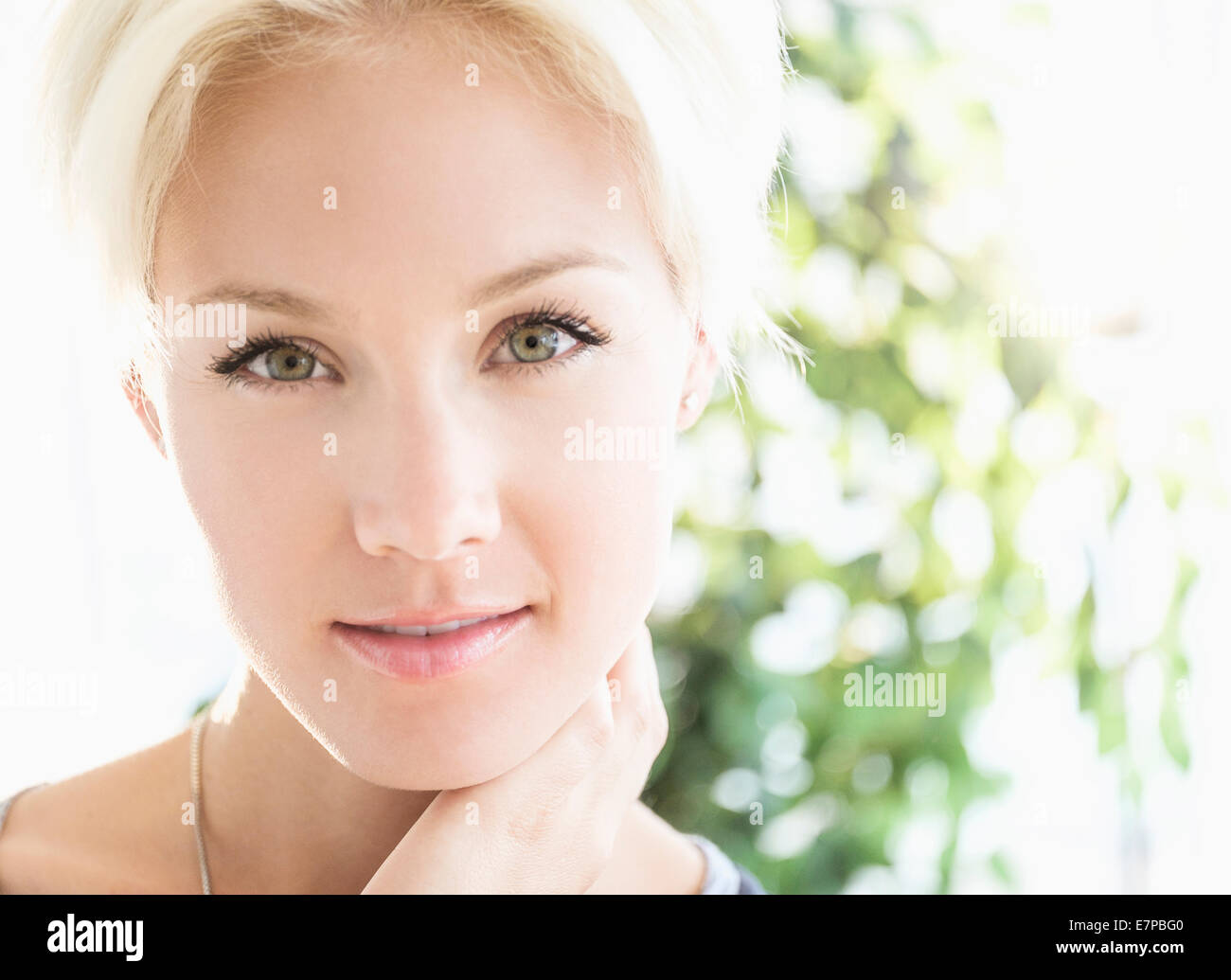 Portrait of blonde woman smiling Stock Photo